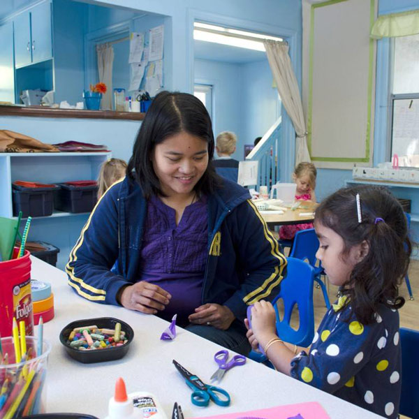 student and teacher during craft time